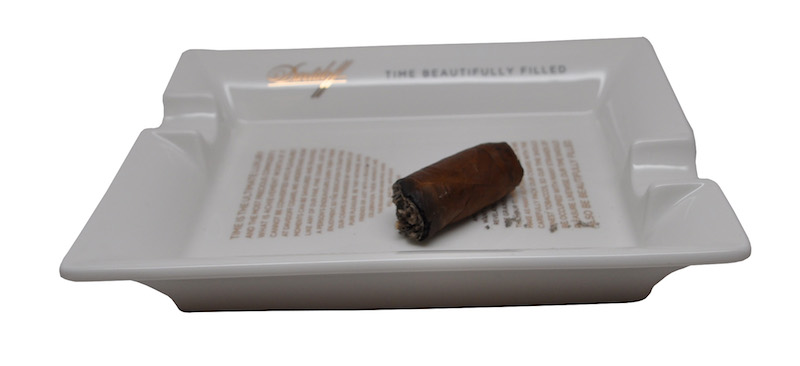 How to Smoke a Cigar: When finished, lay your cigar in the ashtray instead of stubbing it out